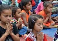 Children in Prayer in Jerusalem, Israel and Papua, Indonesia